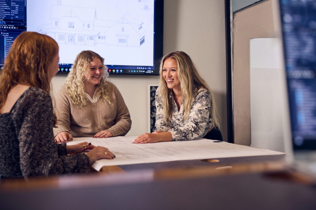 Design Consultation with Customers reviewing Blue Prints with Drury Designs Inc in Green Bay Wi